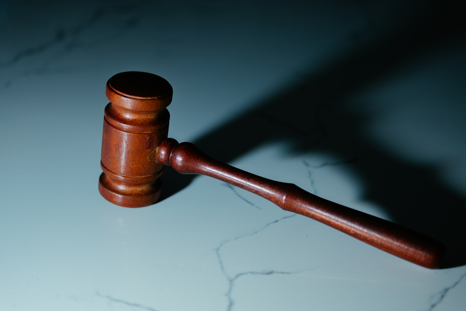 A wooden judge's gavel representing cannabis law and regulation